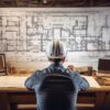 vecteezy_ai-generated-an-engineer-working-on-architectural-plans-with_36053281